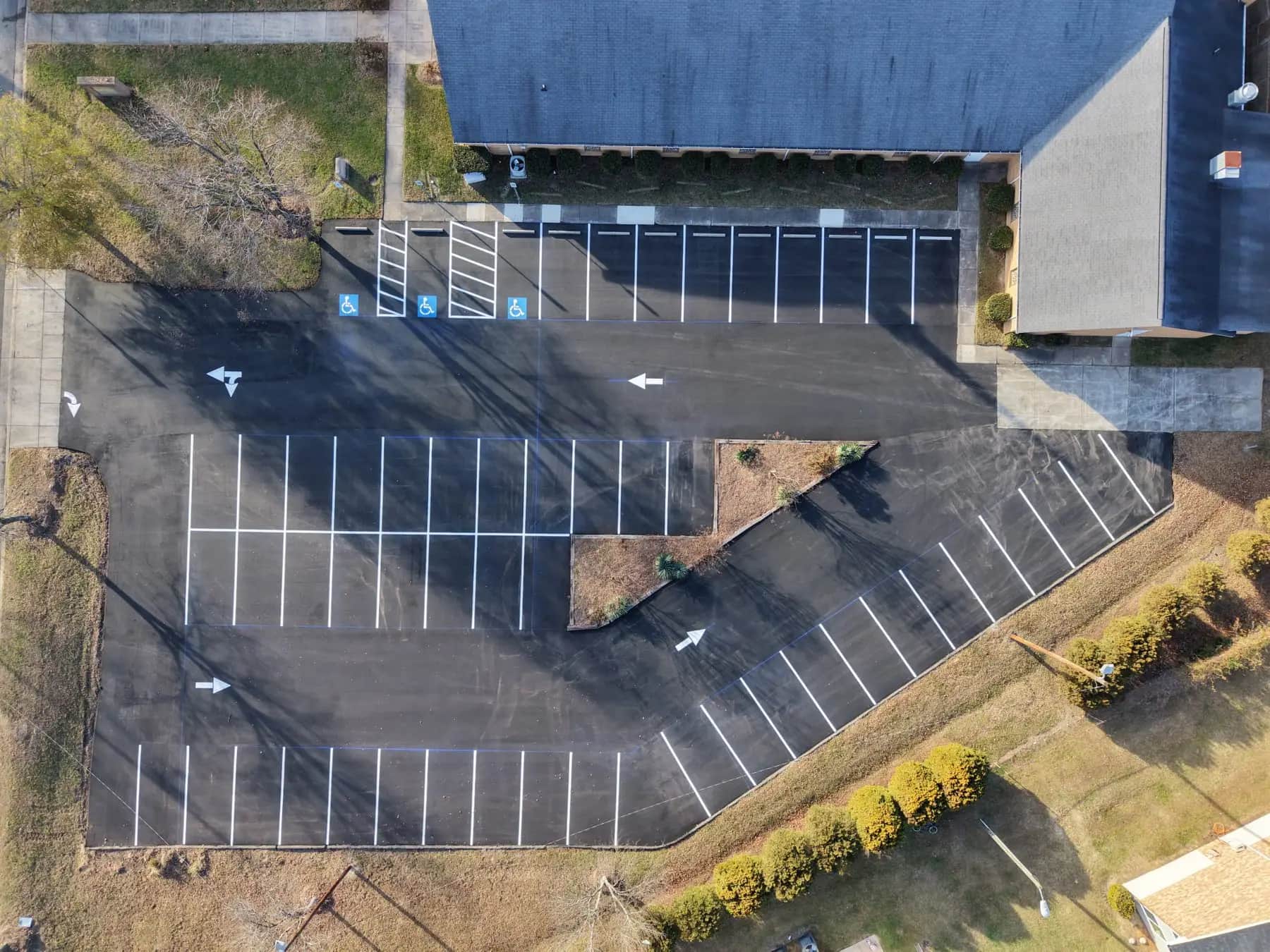 Aerial view of a completed Crown Paving lot, paved and striped to layout