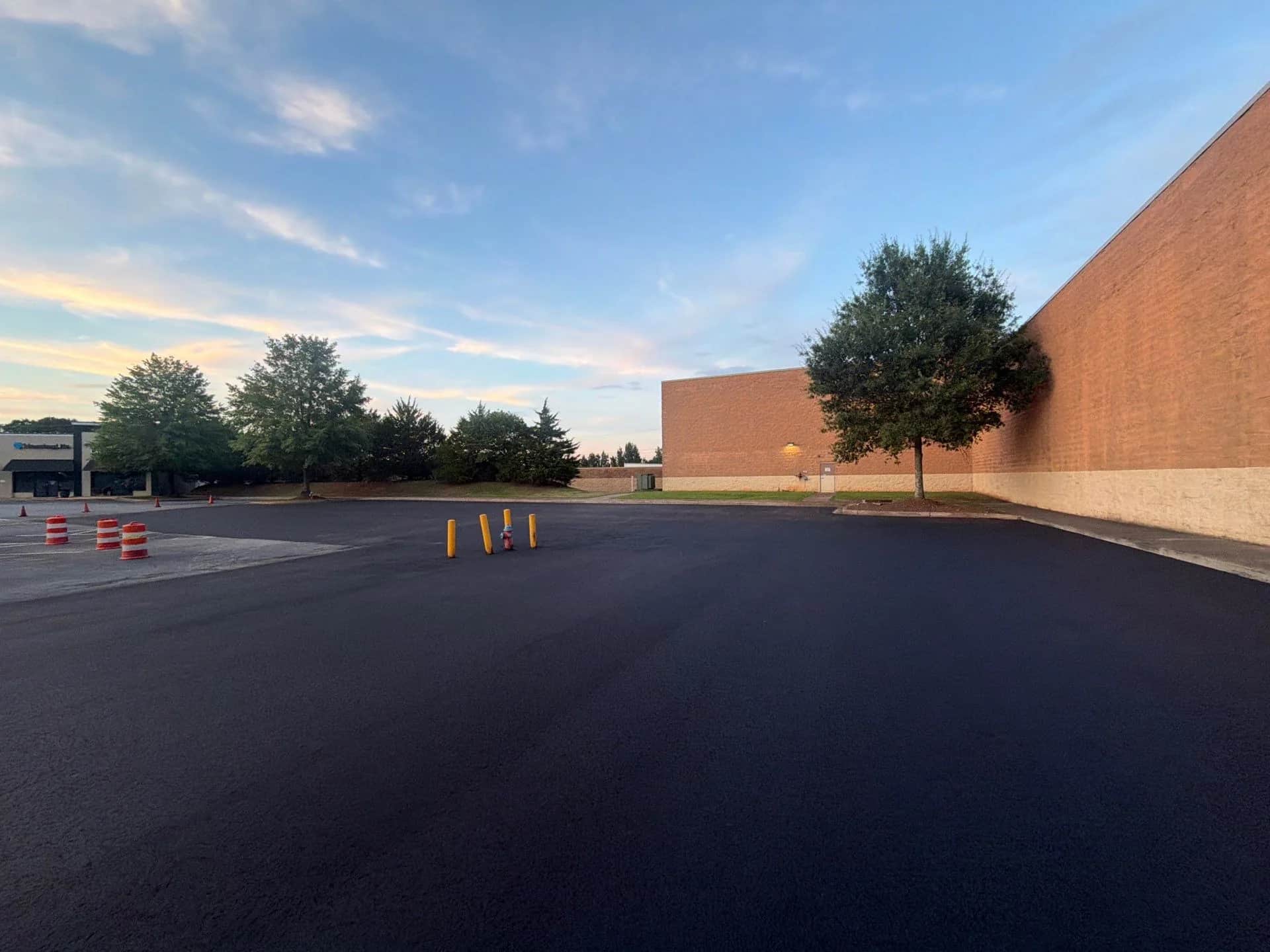 Resurfaced retail parking lot in Spartanburg, SC at sunset
