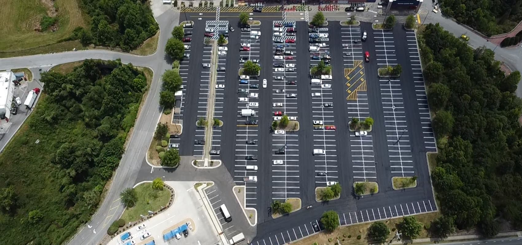Aerial view of a completed shopping center parking lot