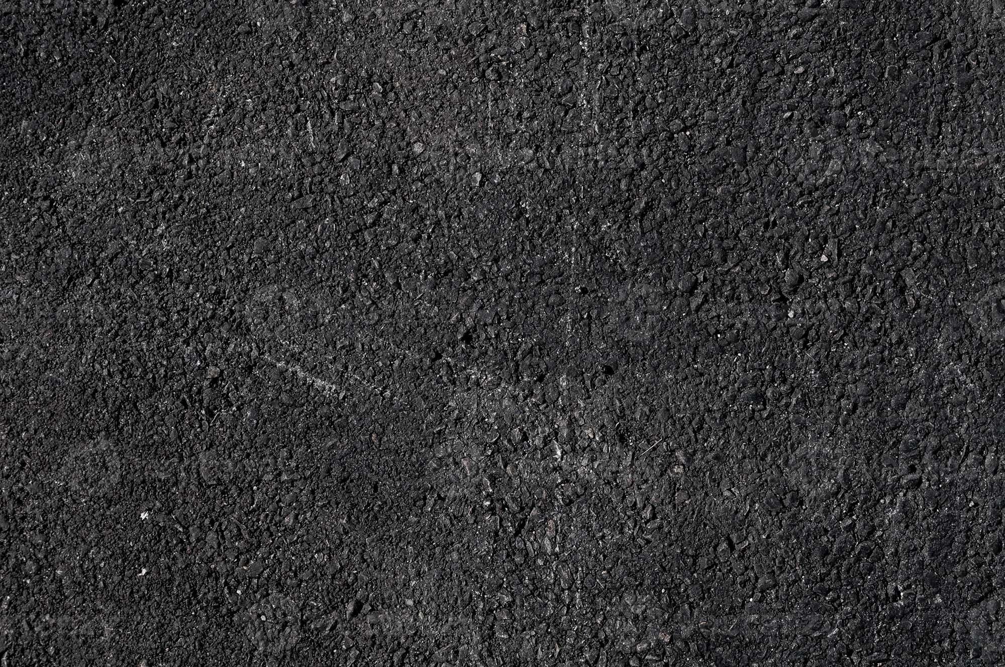 Close-up of compacted asphalt, aggregate bound in bitumen