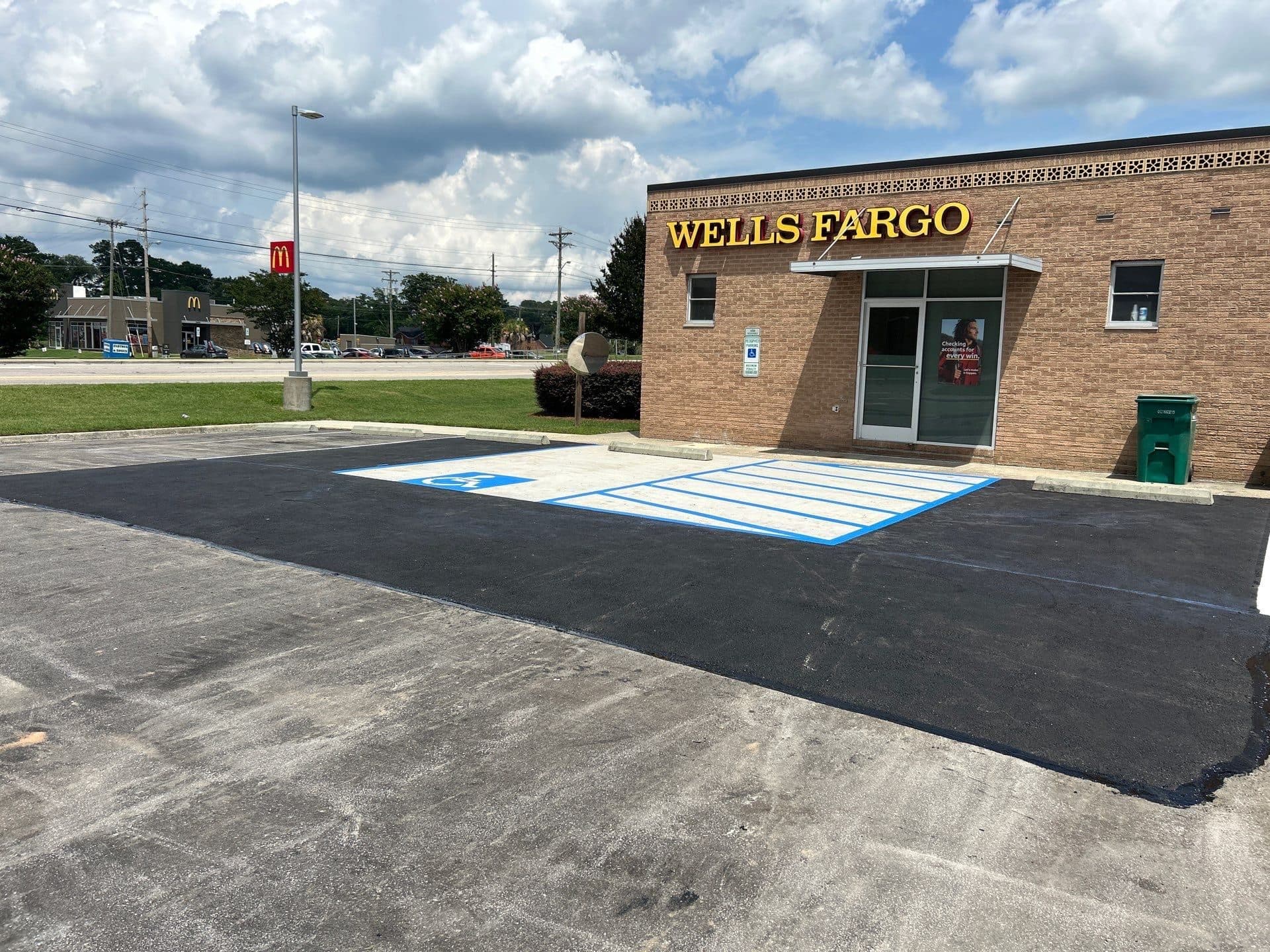 Completed asphalt patch at a Wells Fargo parking lot