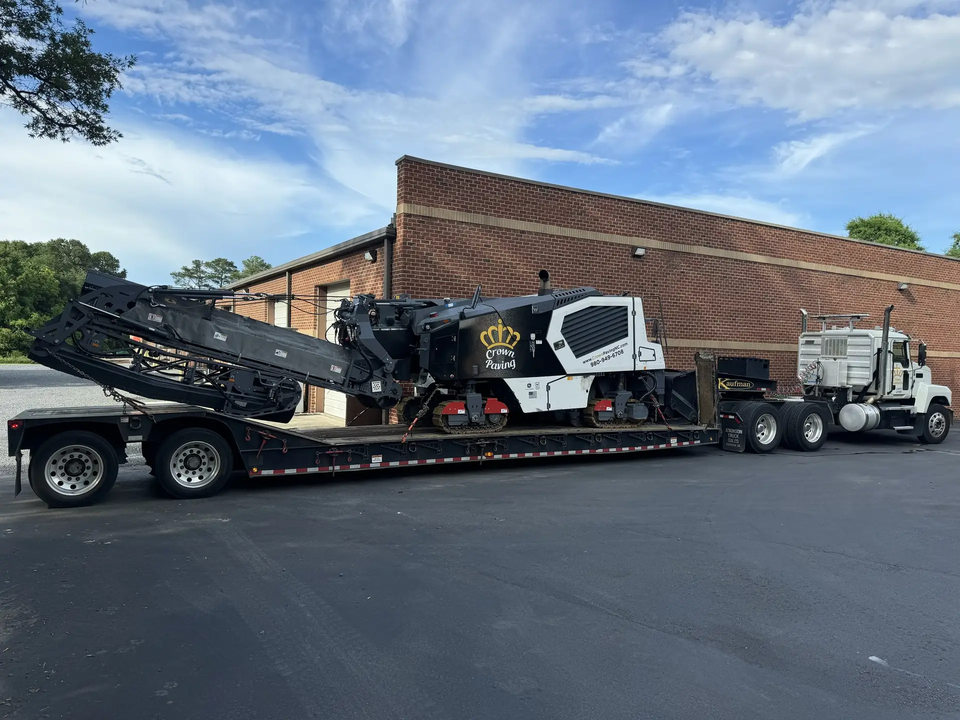 Crown Paving milling machine working a commercial parking lot