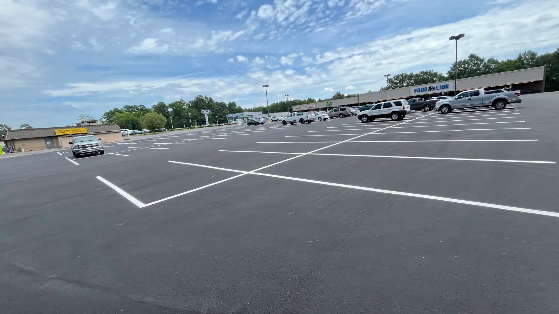 A large commercial parking lot with crisp new line striping