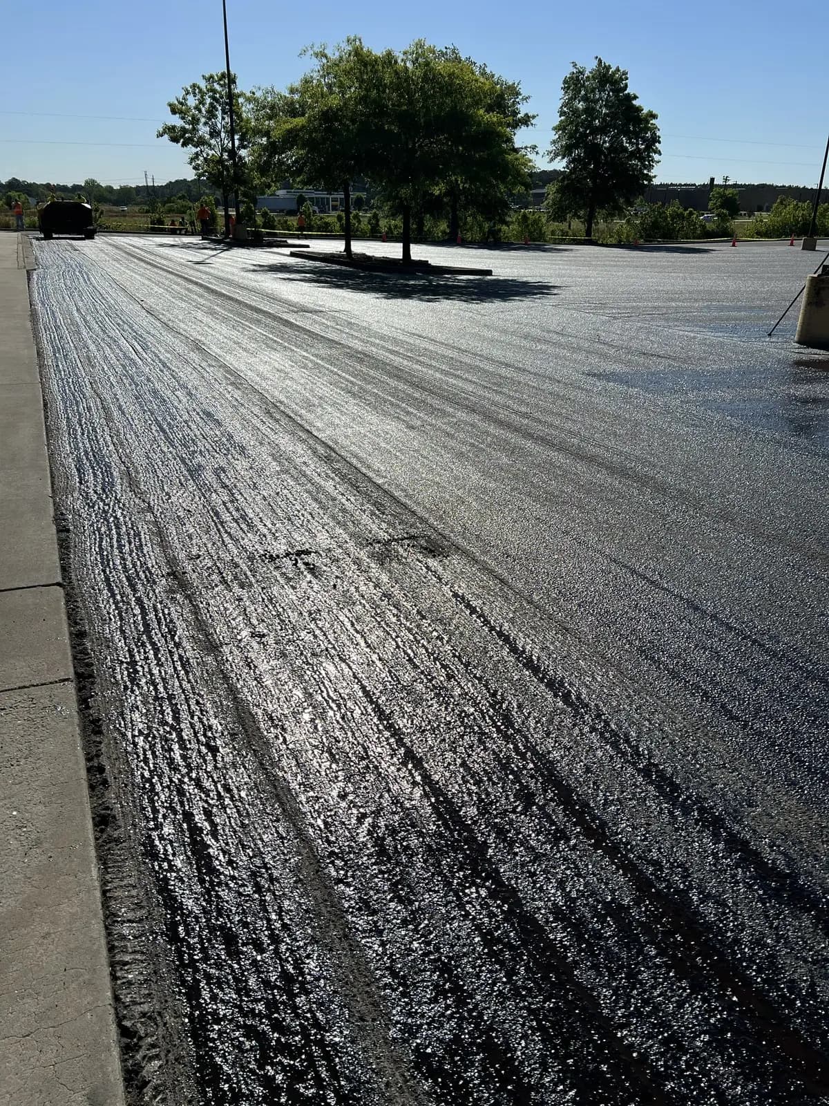 Freshly milled asphalt surface across a commercial parking lot