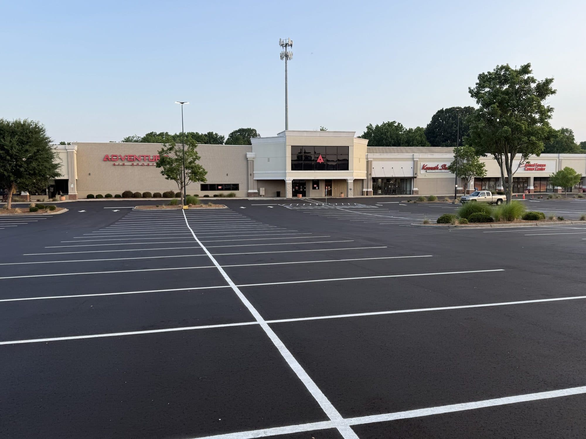Completed asphalt surface and fresh striping at Northeast Plaza