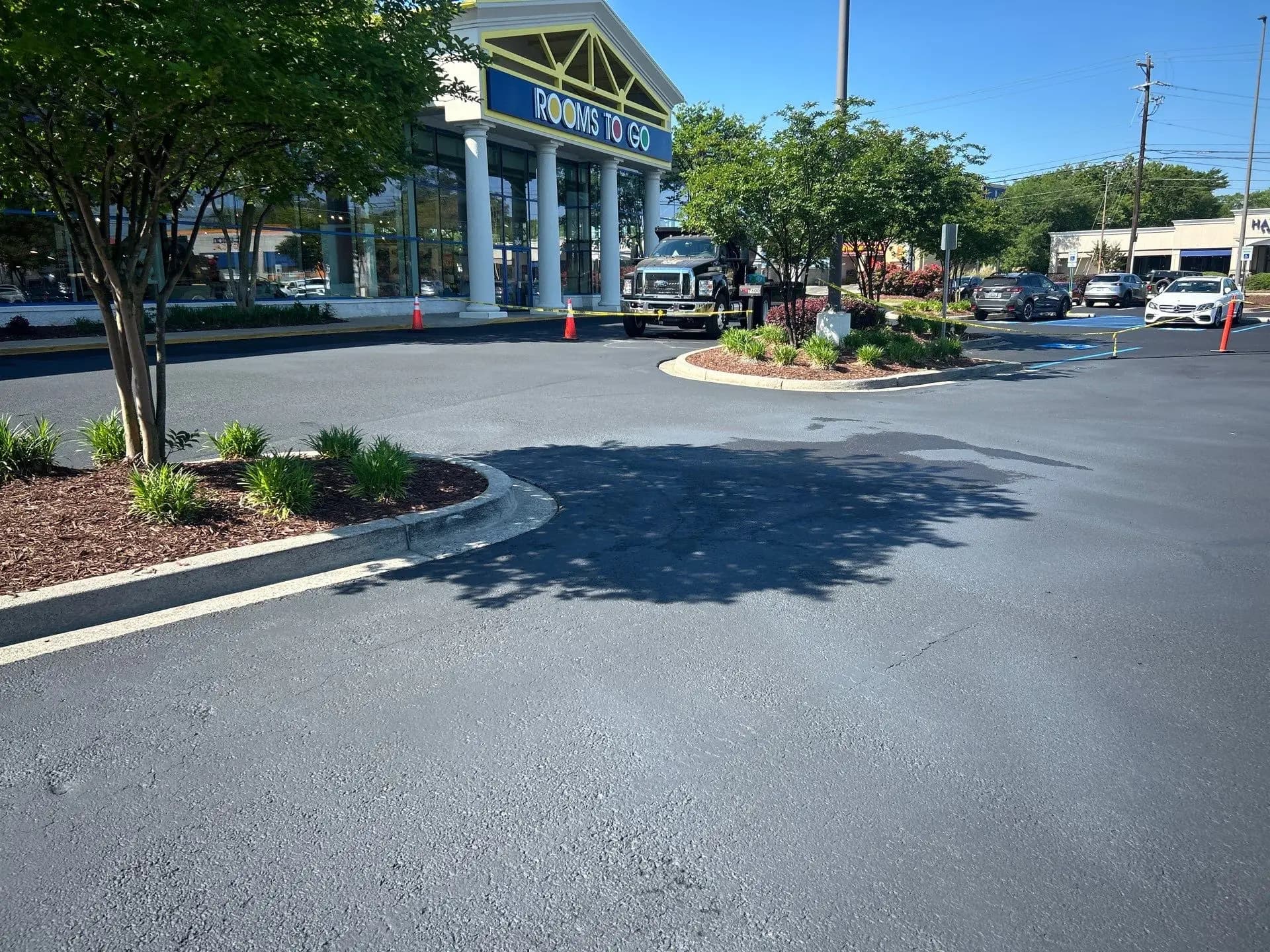 Seal coating underway at a Rooms To Go store