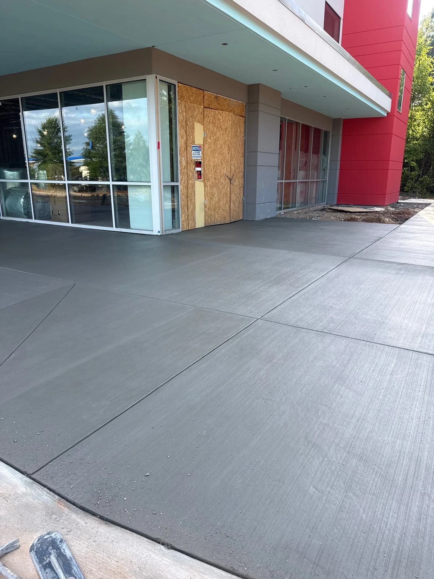 Finished concrete flatwork at the hotel building entrance
