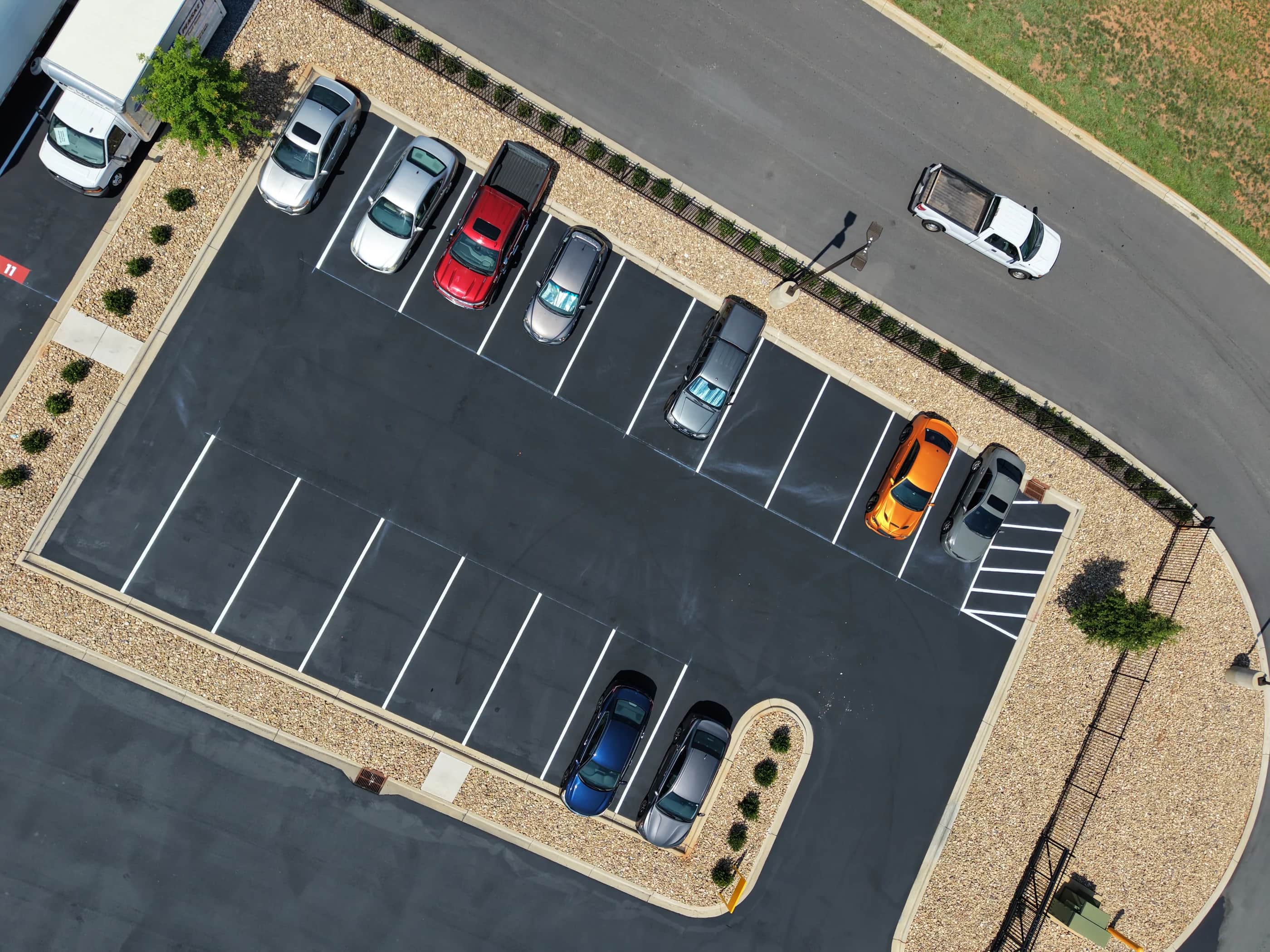 Crown Paving crew sealing a commercial yard, seen from above