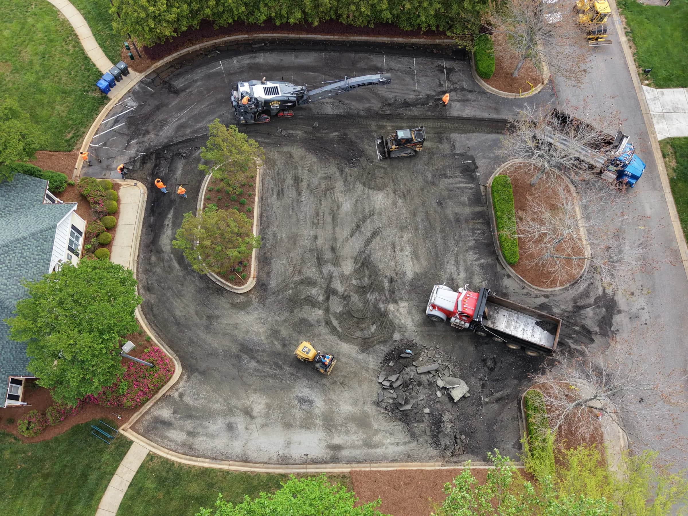 Aerial view of a commercial lot stripped to base, mid-reconstruction