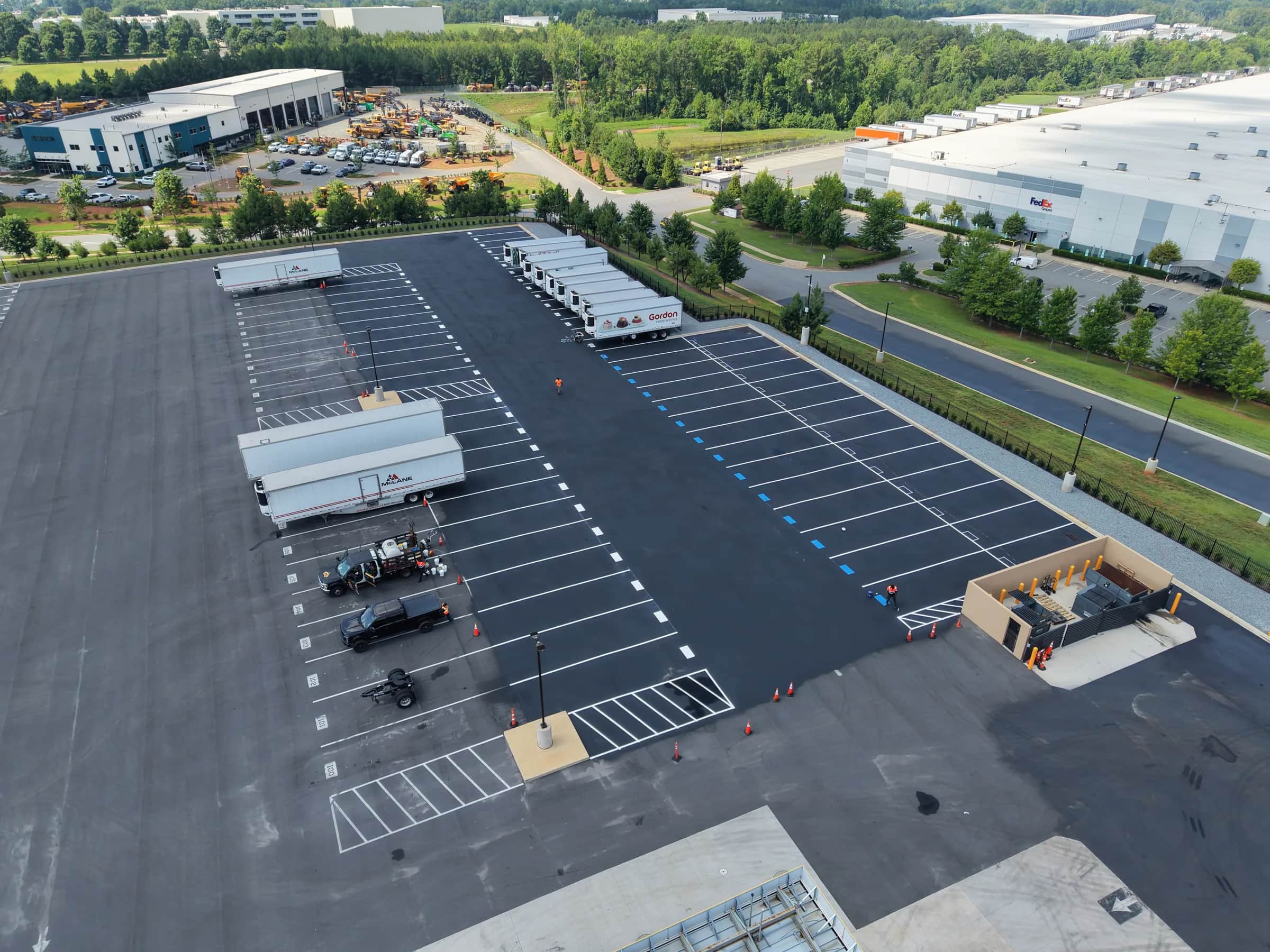 Aerial view of a completed truck yard, trailers lined up on fresh striping