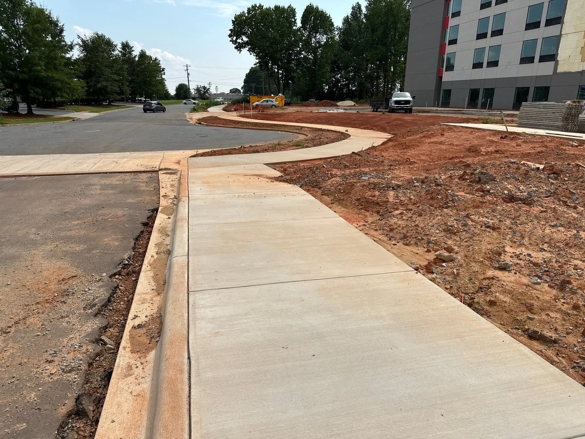 Sidewalk run poured alongside new curb during construction