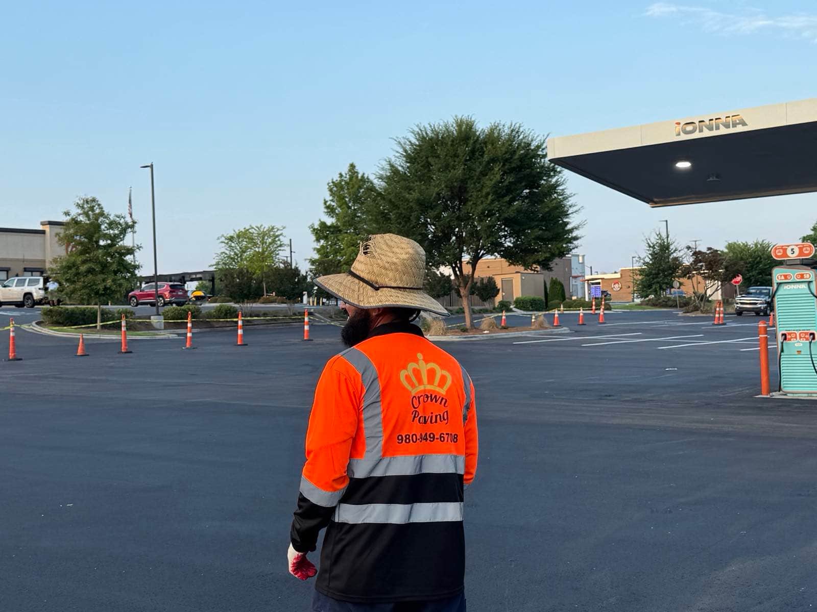 Crown Paving crew member in branded workwear on site