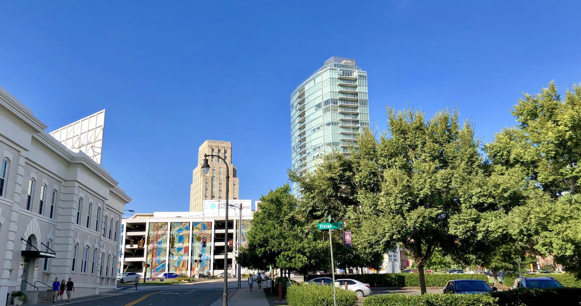 Downtown Durham rising above a street near the American Tobacco Campus