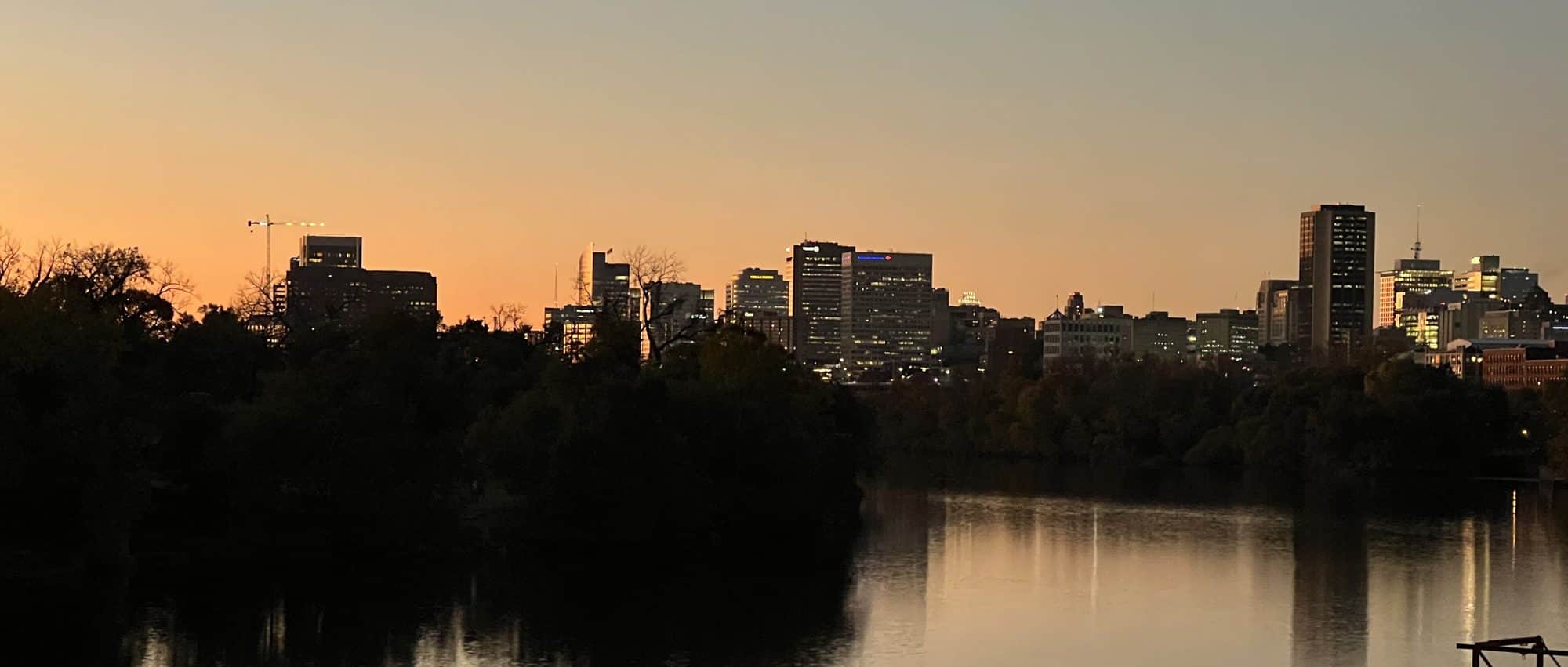 The Richmond skyline at sunset above the James River